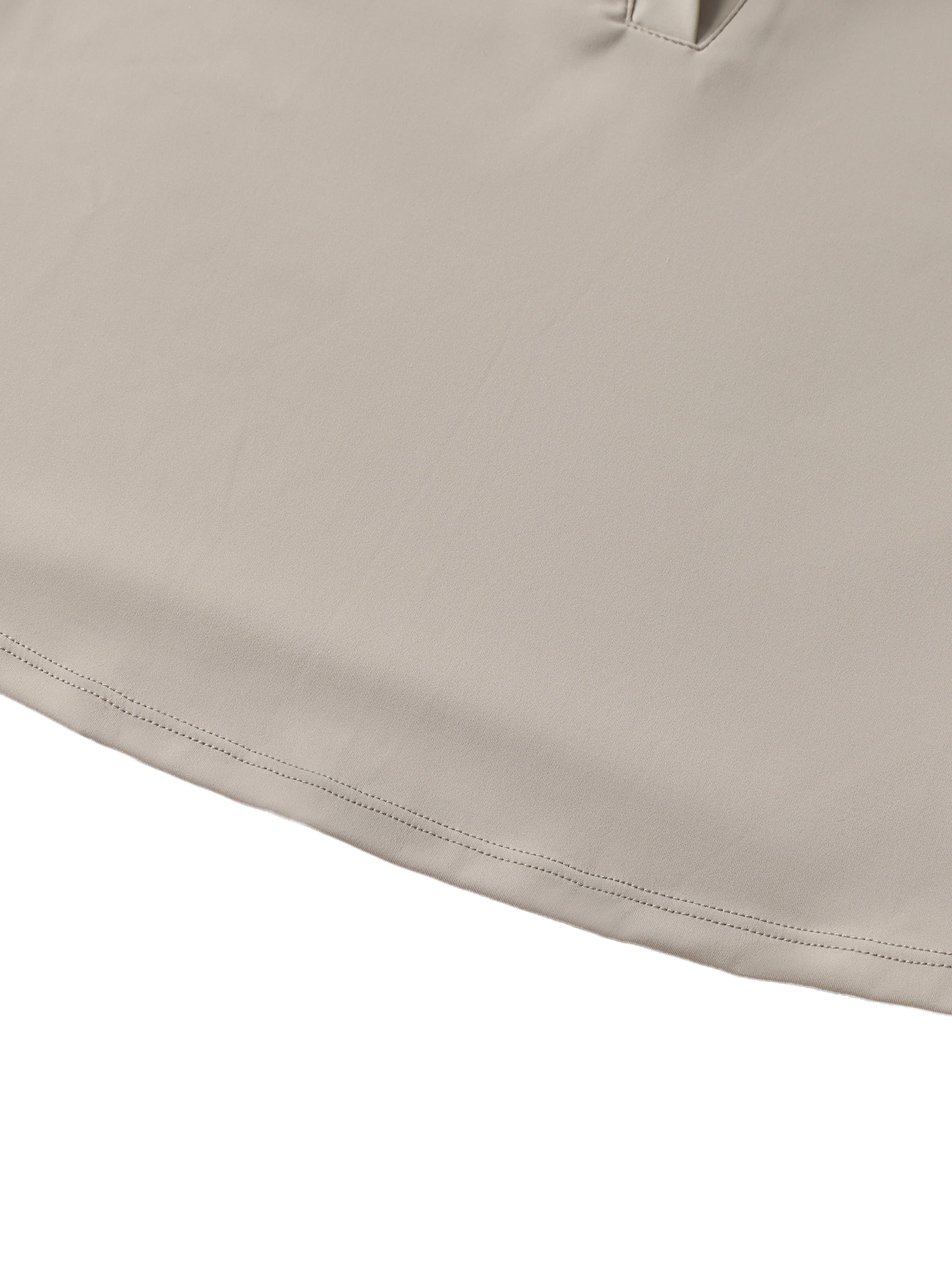 Close-up of beige V-neck lapel crop top with clean stitching and smooth fabric