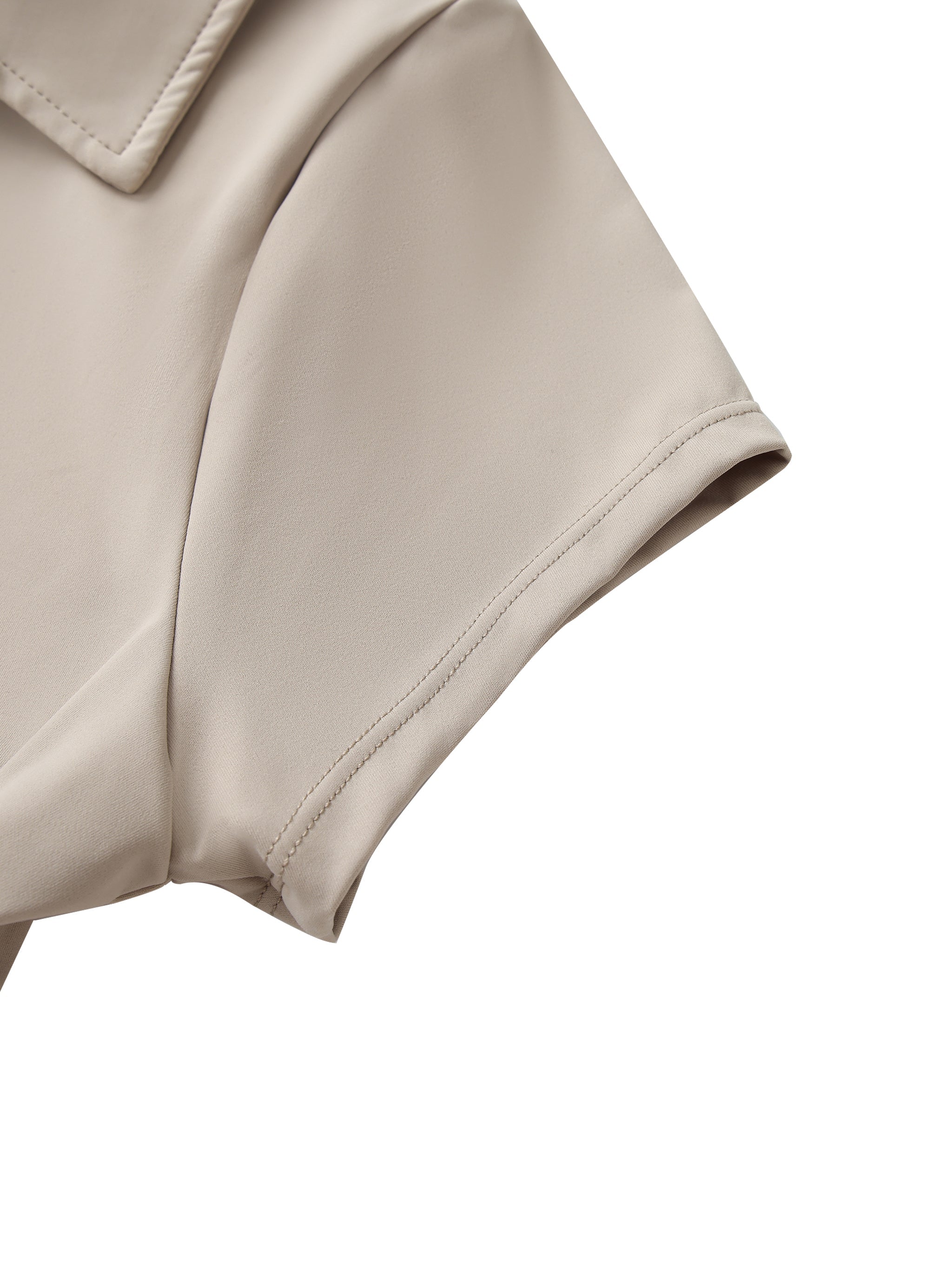 Close-up of beige v-neck lapel crop top sleeve with smooth fabric texture