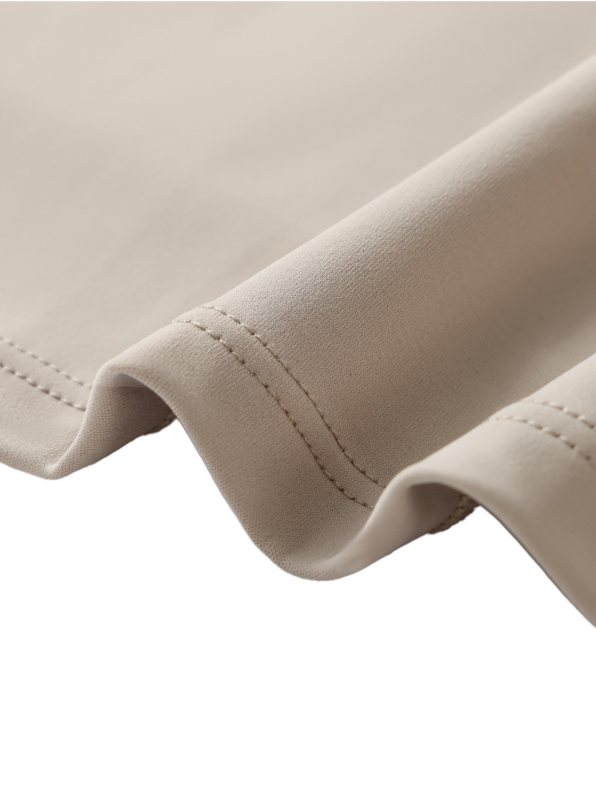 Close-up of beige heavyweight fabric with double stitching, premium streetwear textile