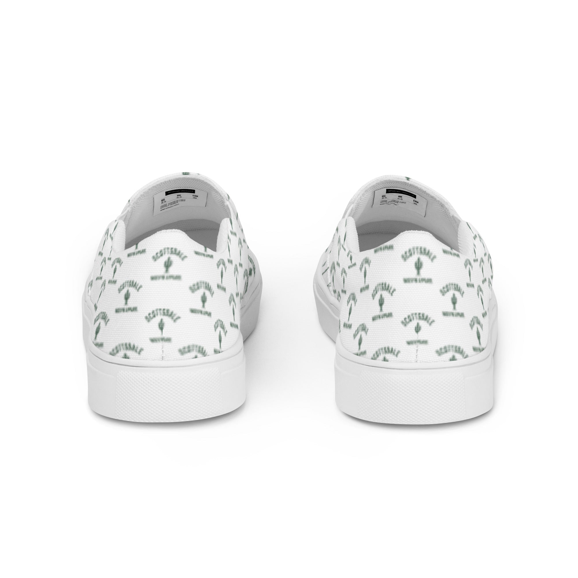 White women's slip-on canvas shoes with green Scottsdale and cactus pattern, rear view