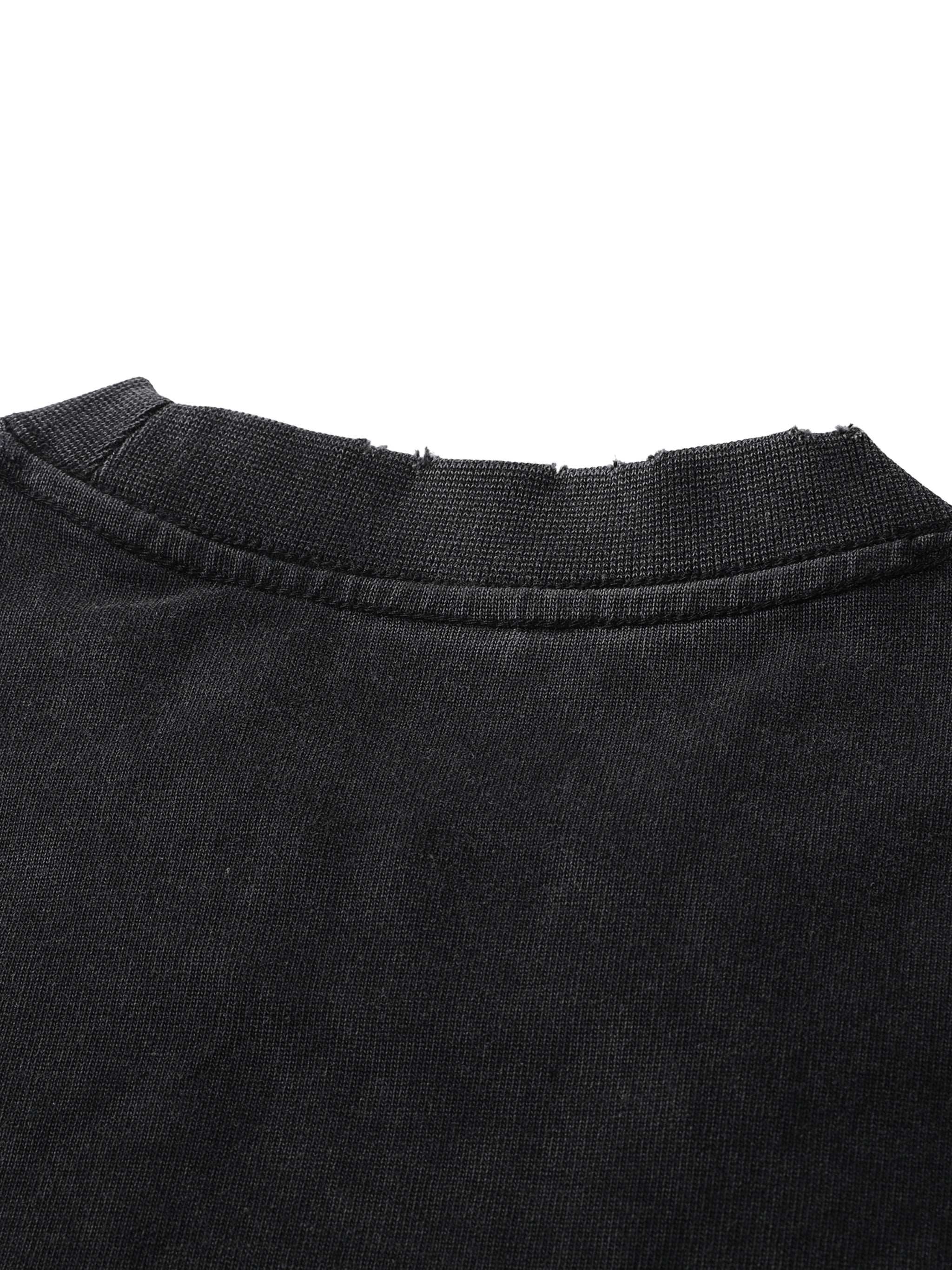 Close-up of black heavyweight t-shirt with vintage washed fabric and frayed neckline