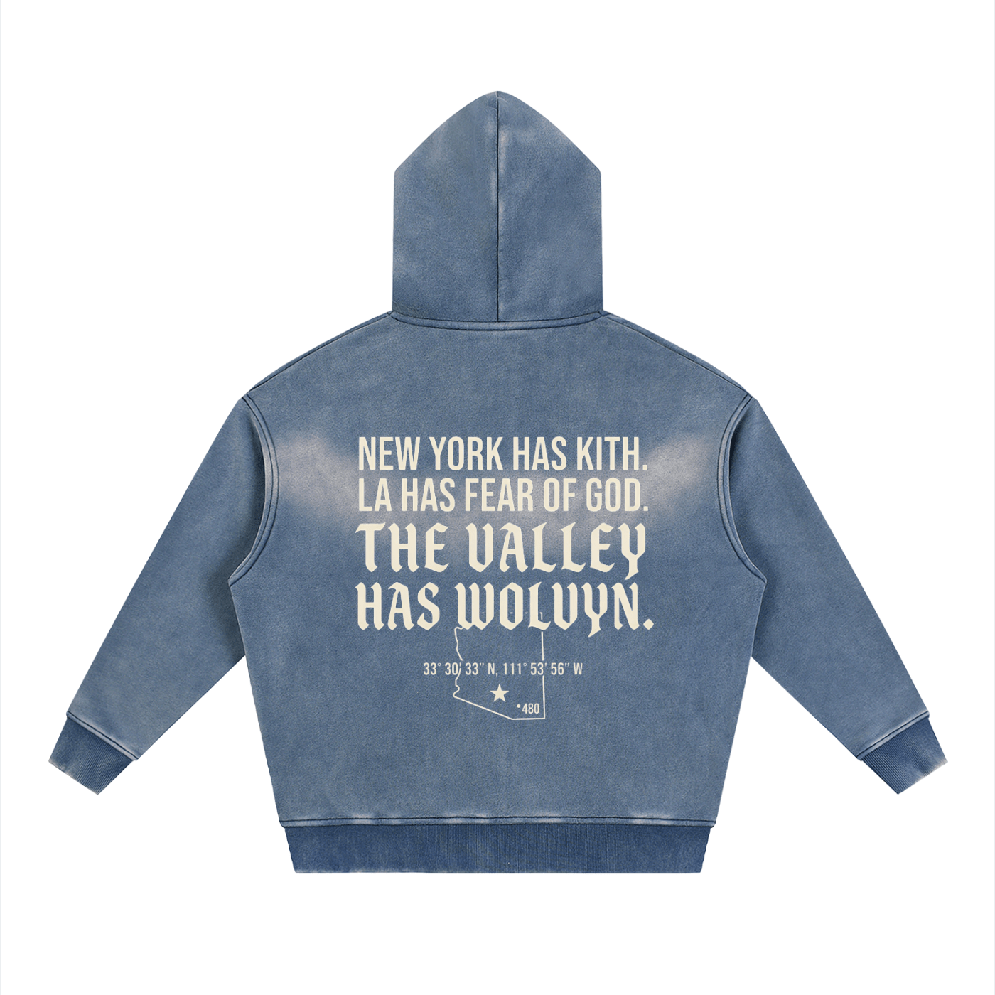 Sunfaded blue fleece hoodie with bold manifesto text and coordinates on the back, streetwear style.