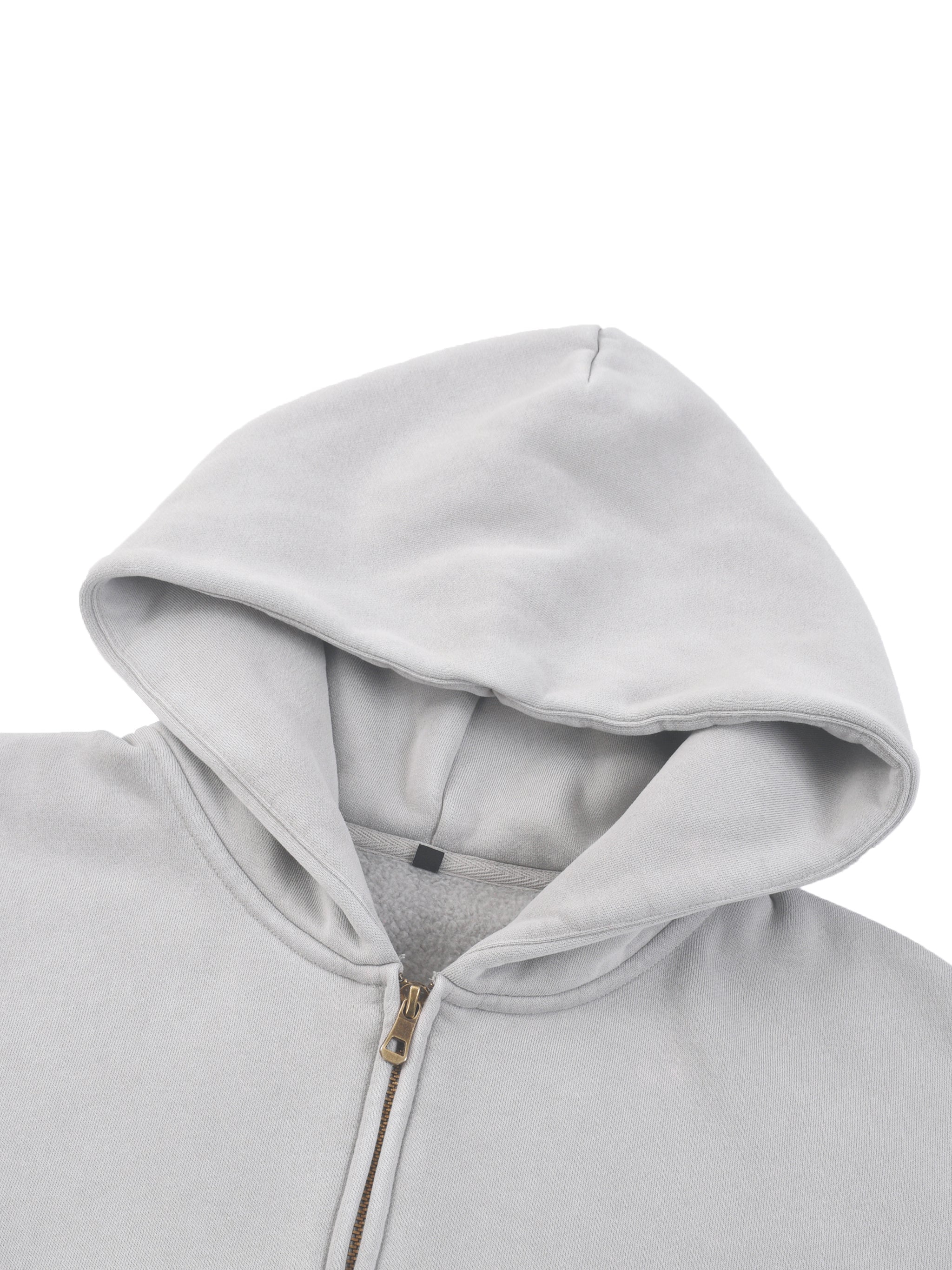 Light gray fleece hoodie with two-way zipper and boxy fit, close-up of hood detail