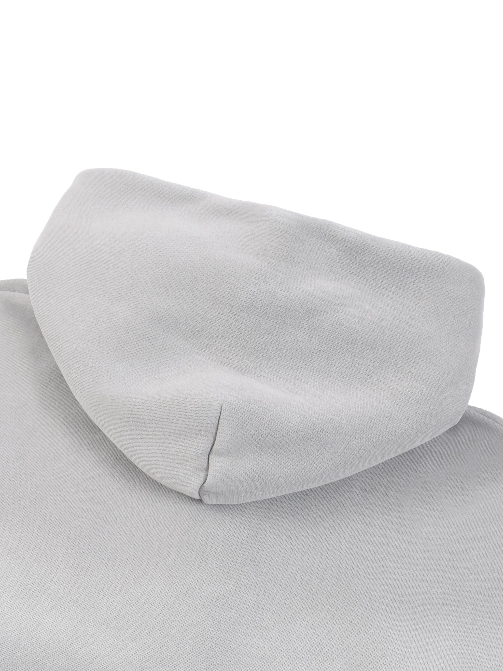 Close-up of a light grey fleece hoodie hood, heavyweight streetwear style