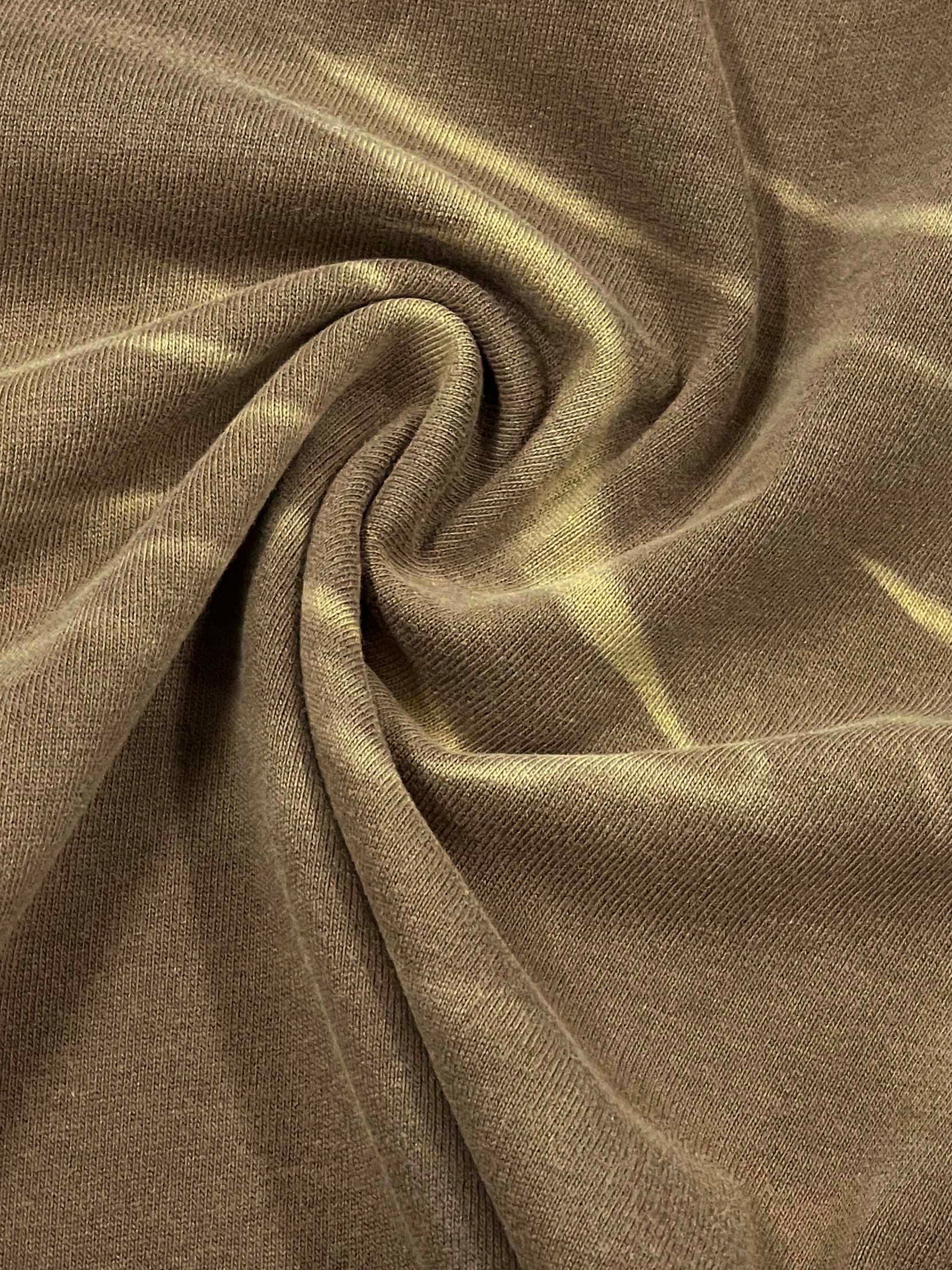 Brown tiger stripe gradient washed t-shirt fabric with textured swirl pattern