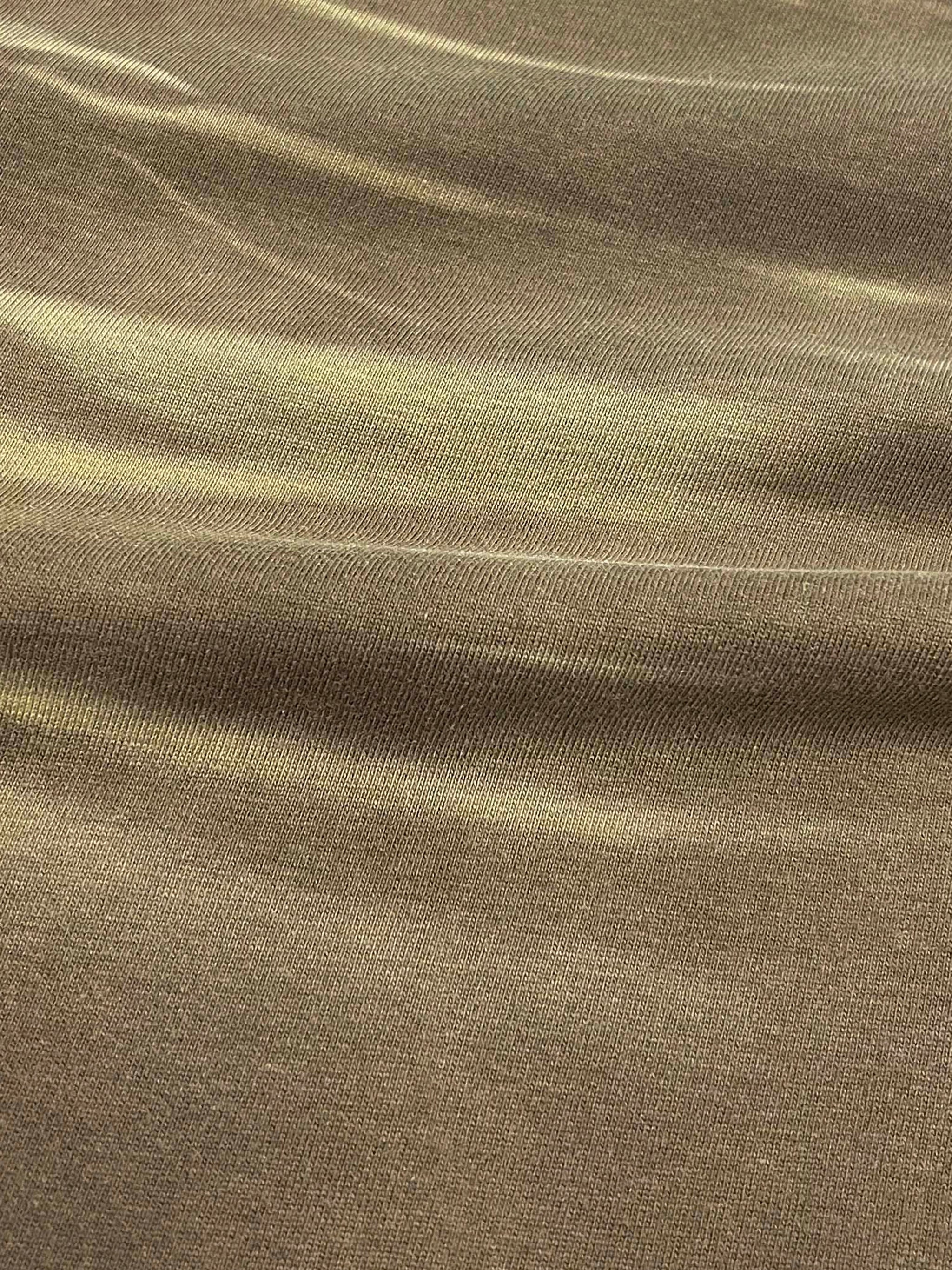 Close-up of heavyweight cotton fabric with tiger stripe gradient wash pattern