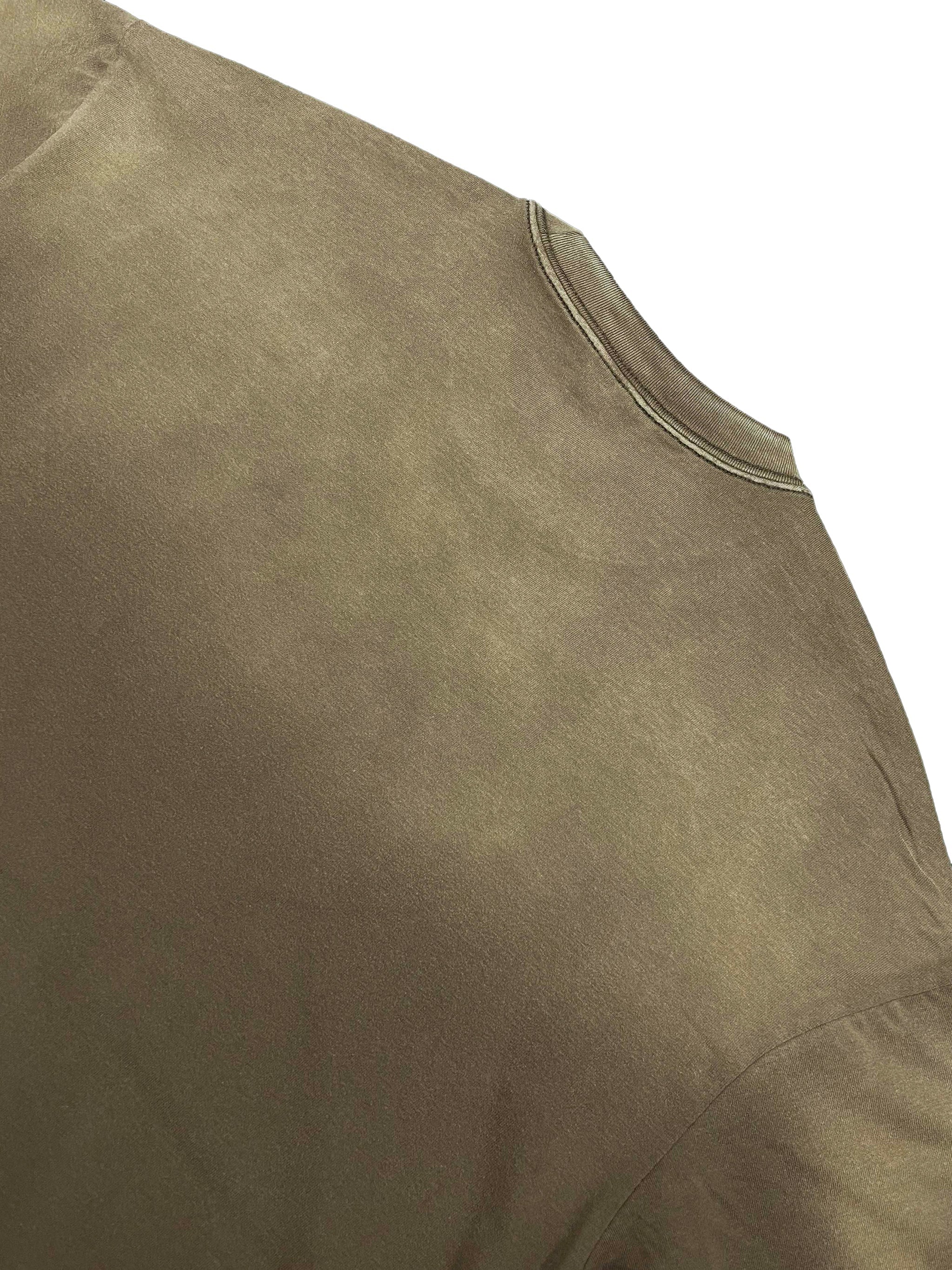 Closeup of olive gradient washed t-shirt fabric and collar, heavy streetwear style