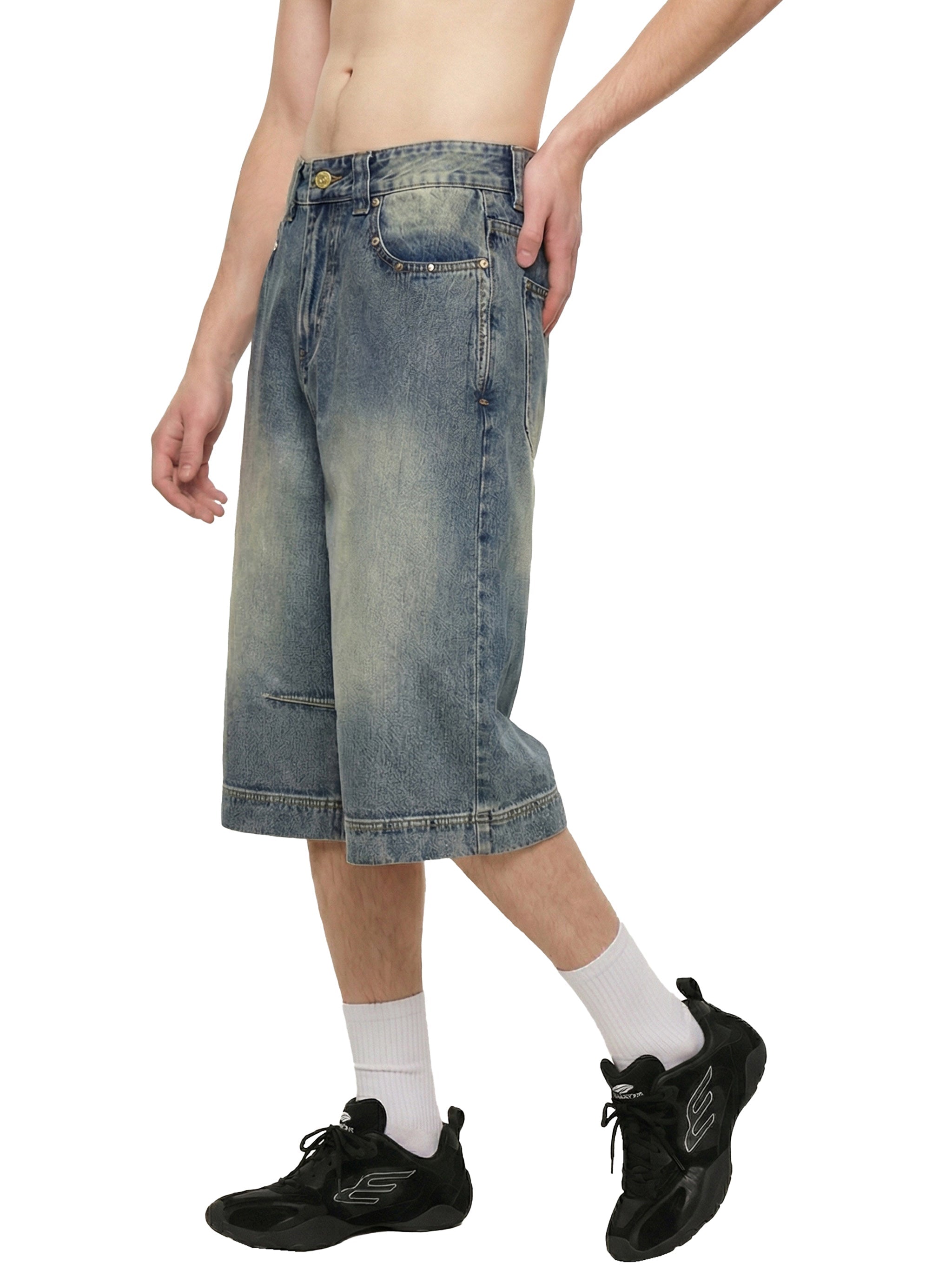 Baggy vintage wash denim shorts on model, streetwear style, knee-length fit