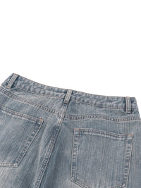 Back view of vintage wash distressed denim jeans with rear pockets and belt loops