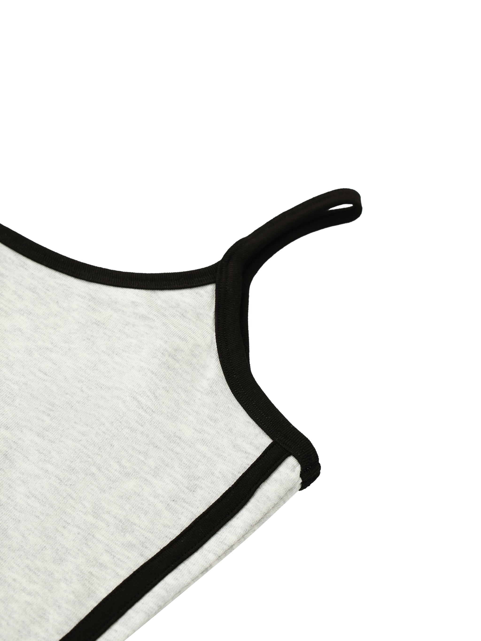 Close-up of women's mini dress with color block black and white trim detail