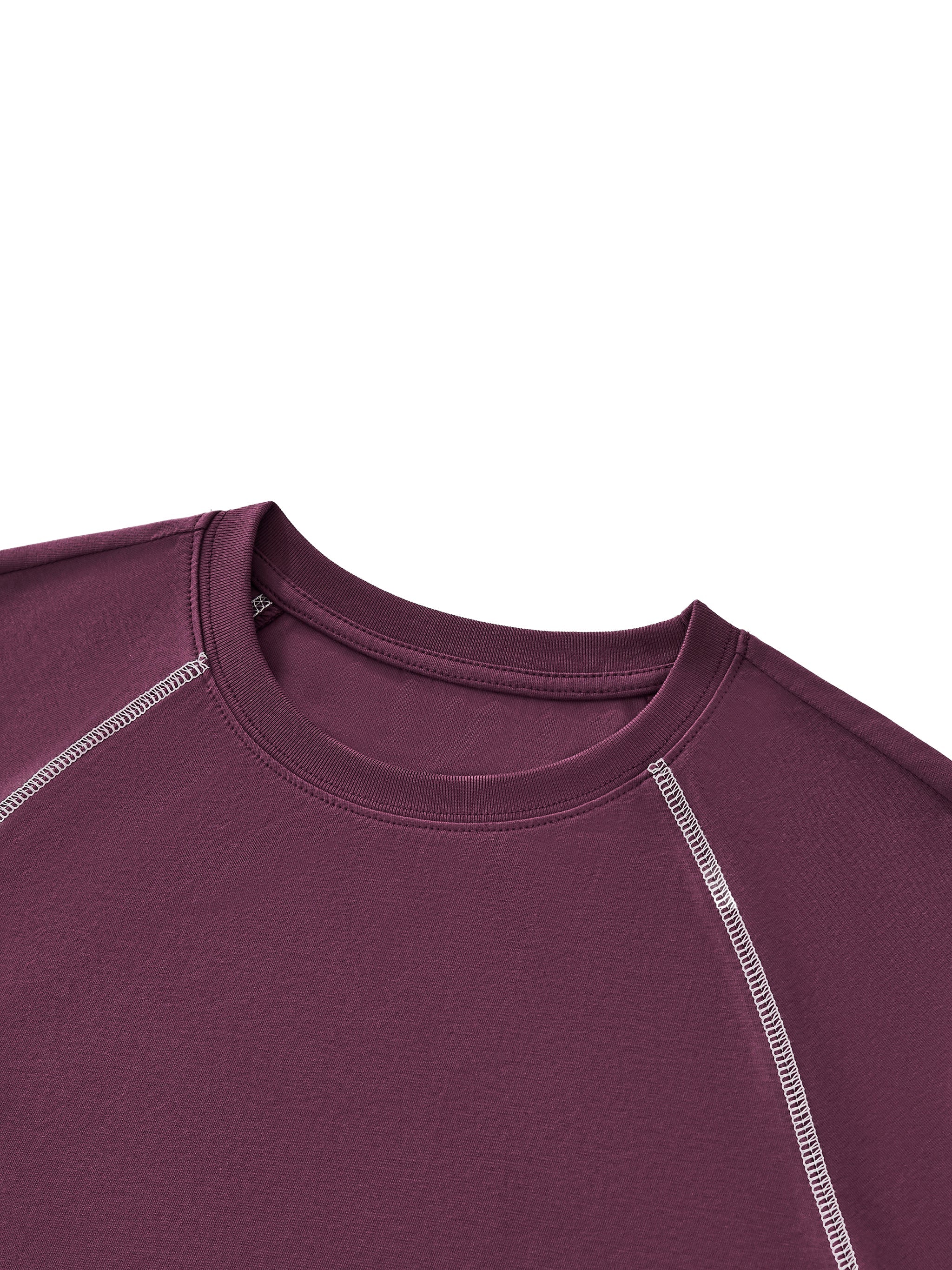 Close-up of women's purple raglan crop t-shirt with contrast stitching details