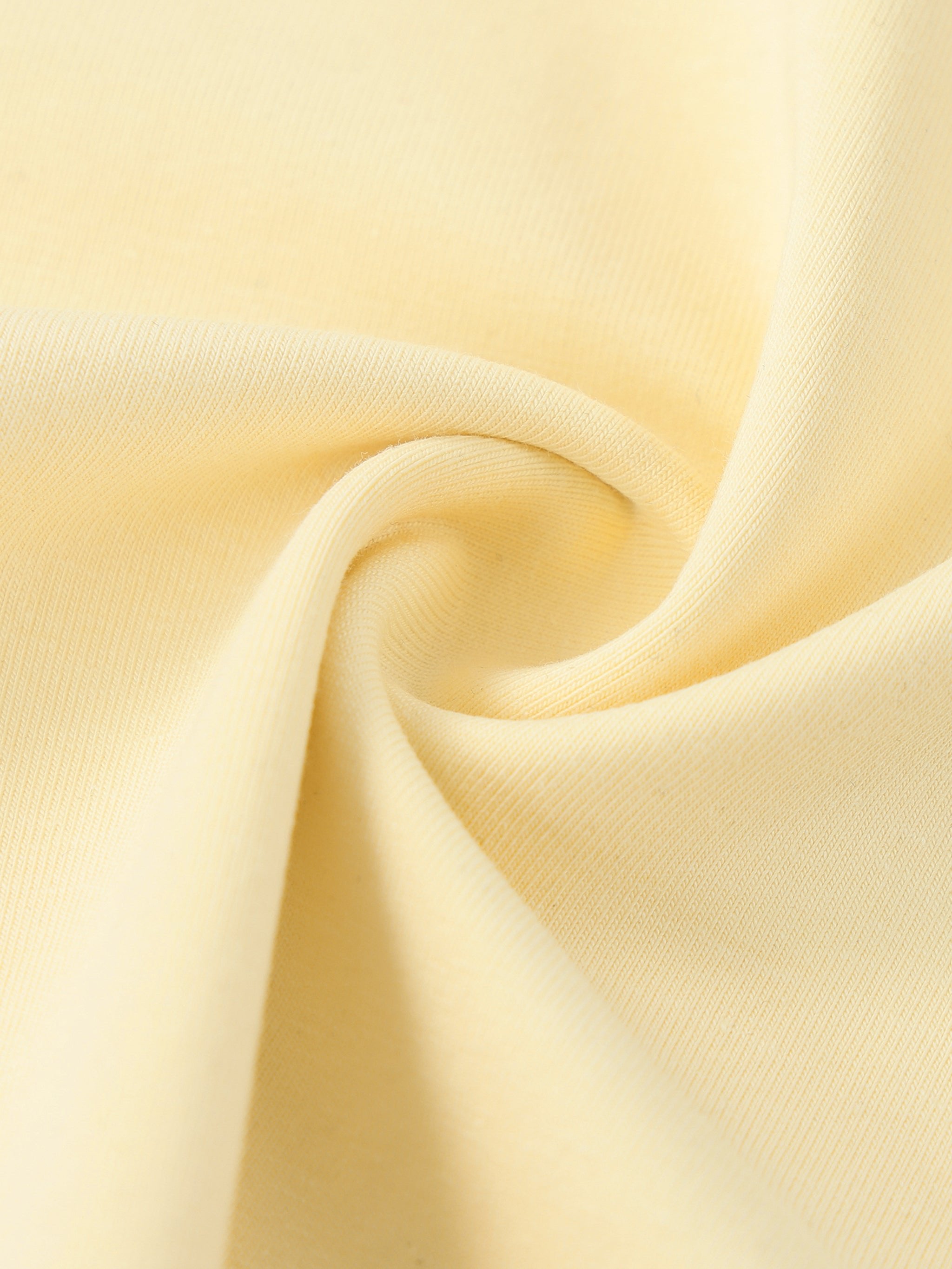 Close-up of soft, light yellow heavyweight cotton fabric with visible texture
