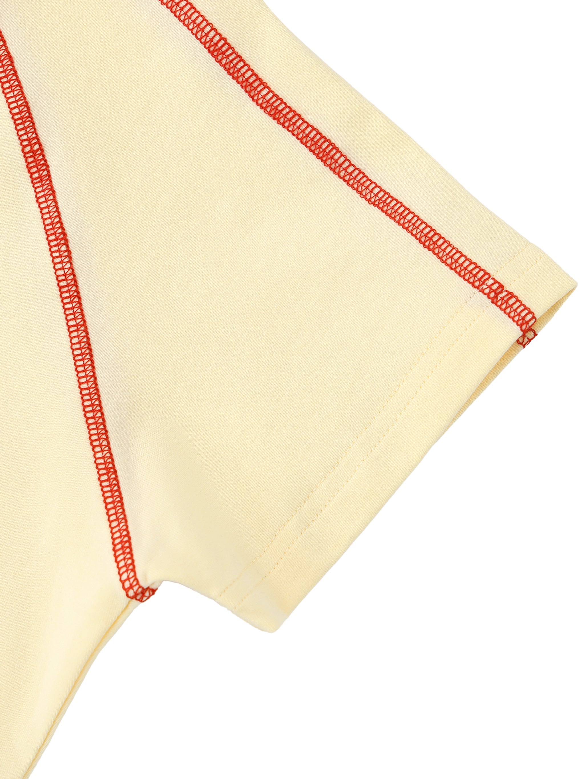 Closeup of a cream women's raglan t-shirt sleeve with bold red contrast stitching