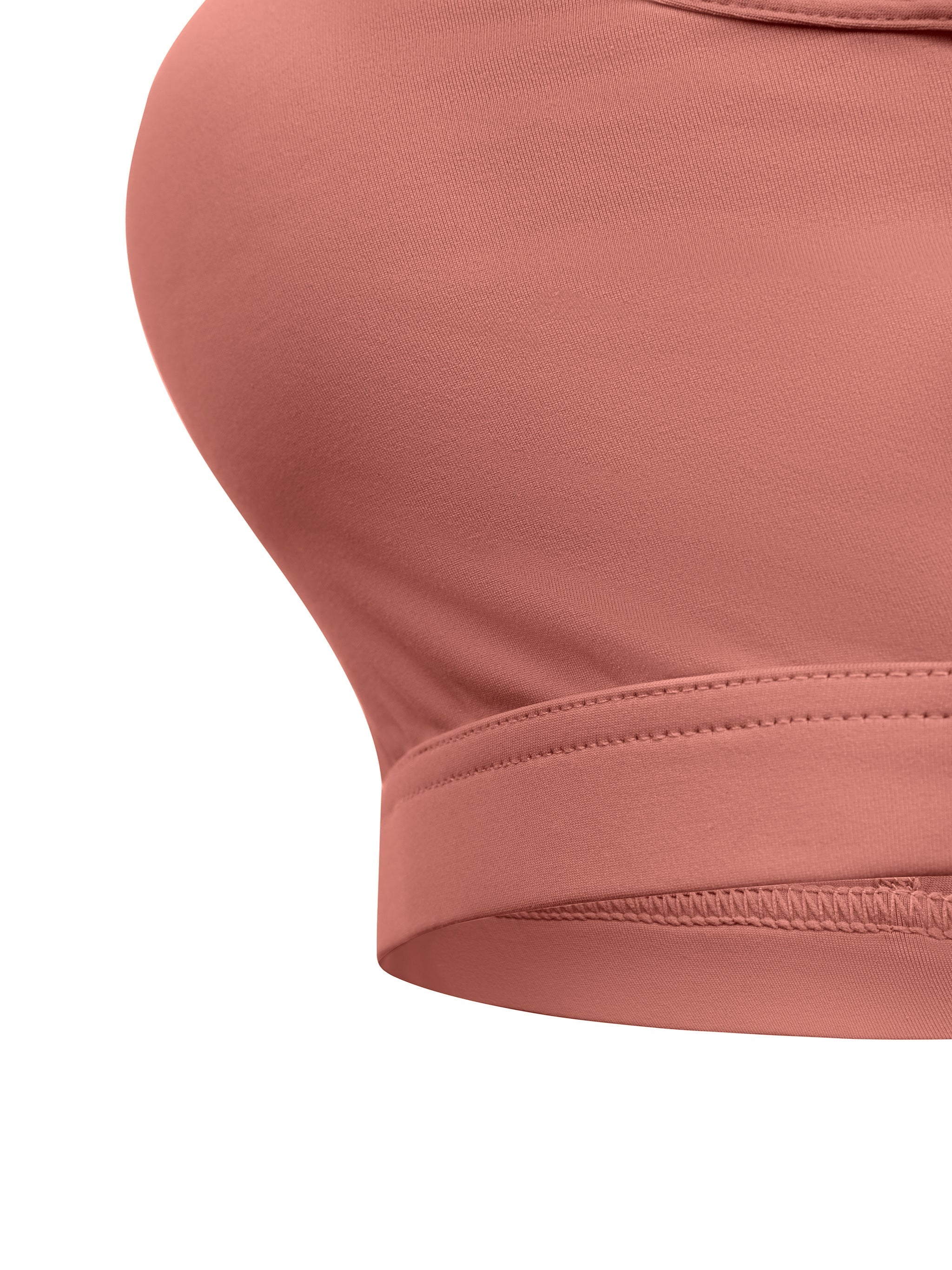 Close-up of mauve cropped sports bra with soft stretch fabric and wide elastic band