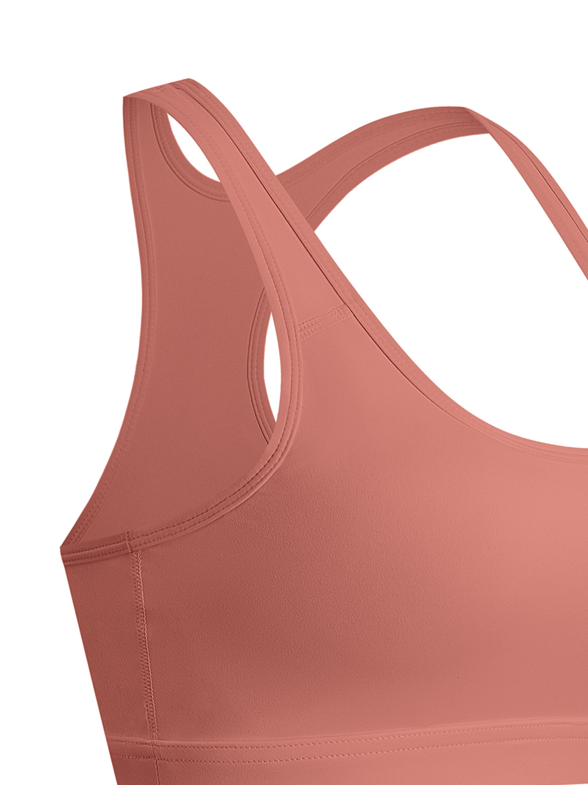 Women's cropped sports bra in muted pink, racerback, seamless activewear design