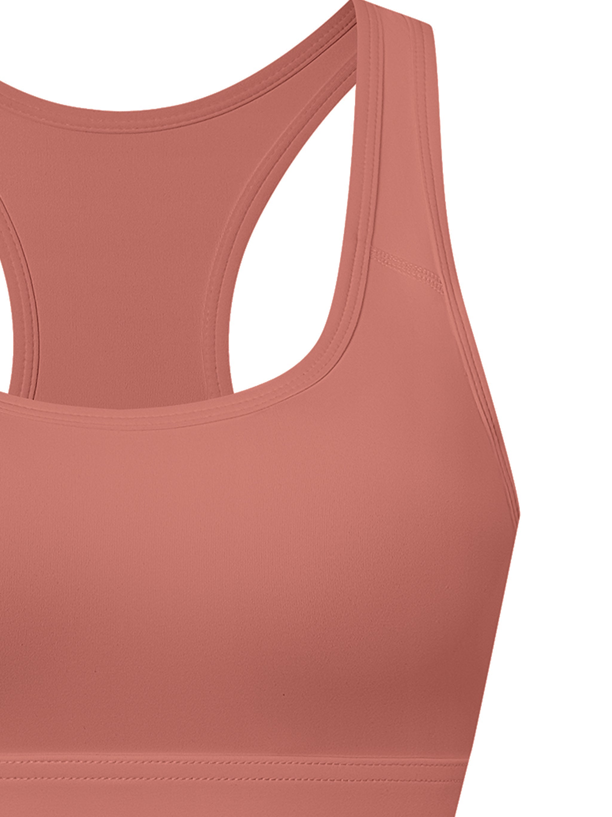 Women's cropped sports bra in light terracotta color with racerback design.