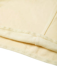 Close-up of cream cropped tube top fabric and stitching detail