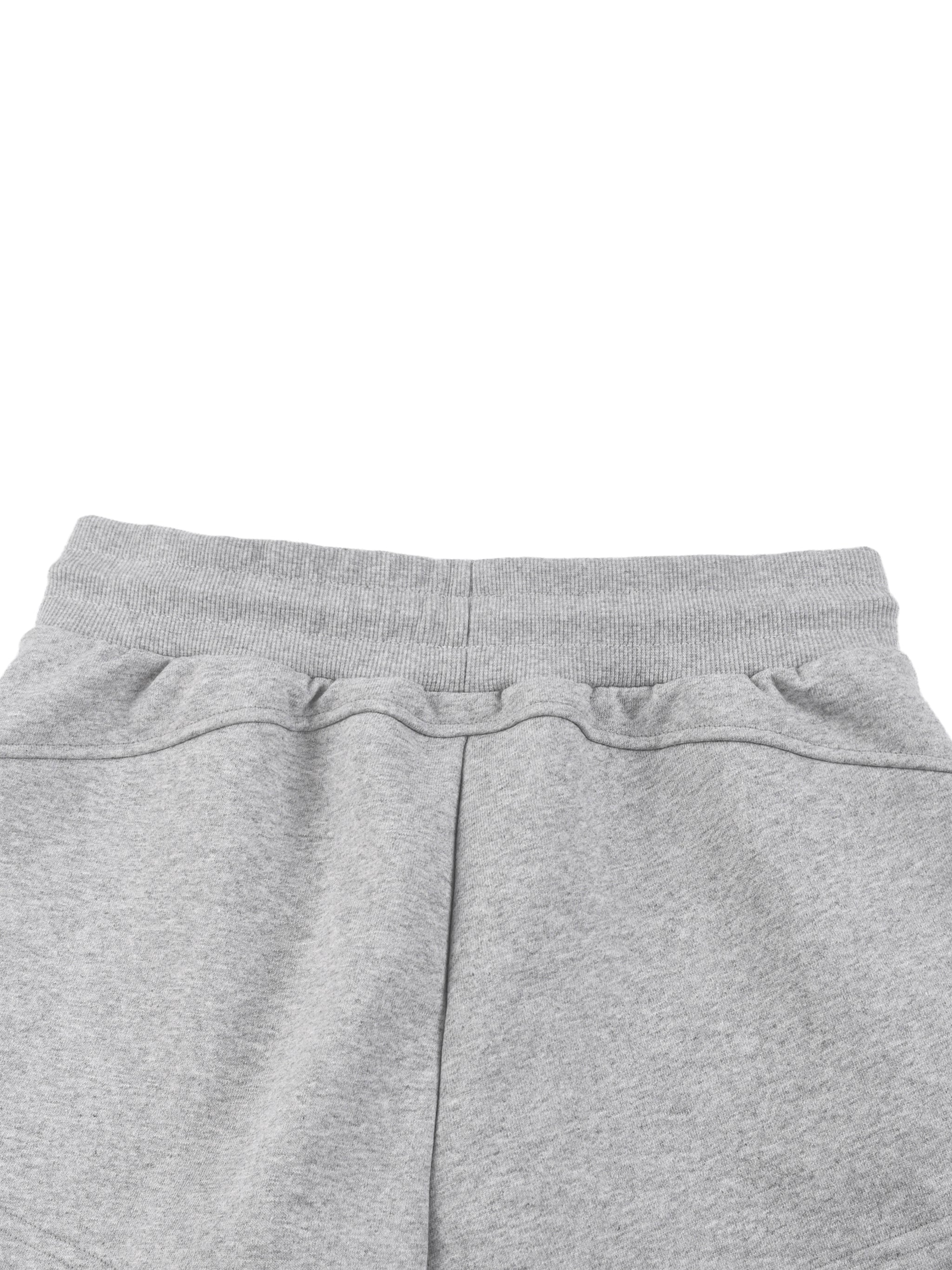 Close-up of gray women's drawstring shorts with elastic waistband, heavyweight streetwear