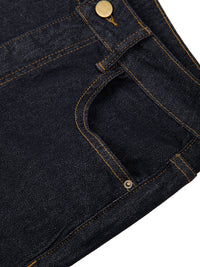 Close-up of women's high-rise skinny jeans in dark denim with gold stitching and rivets