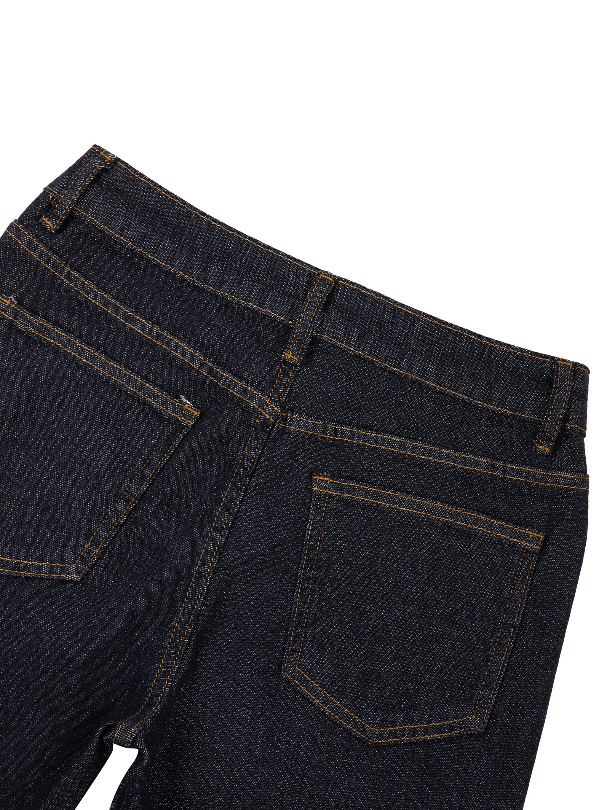 Close-up of women's high-rise skinny jeans back pockets in dark denim