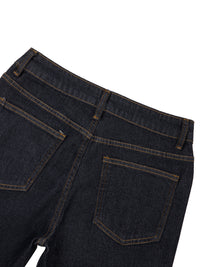 Close-up of women's high-rise skinny jeans back pockets in dark denim
