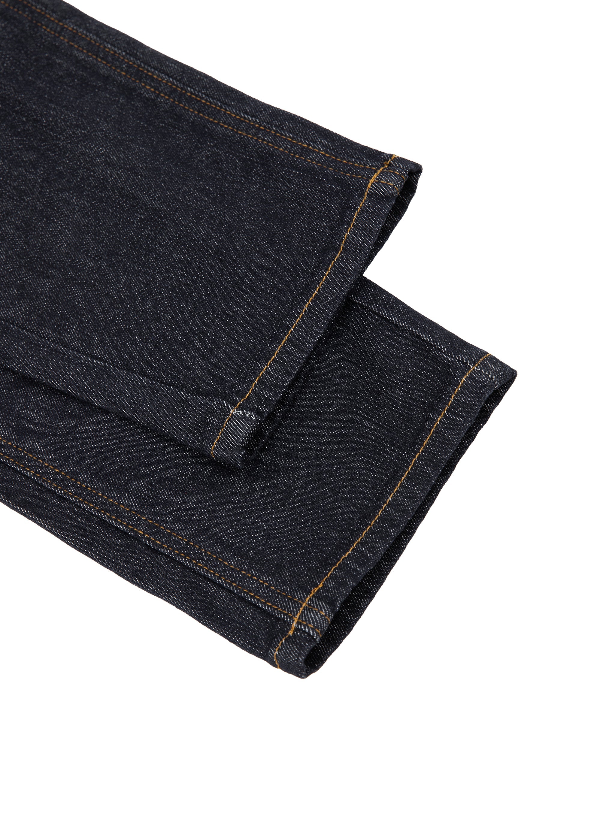 Close-up of dark wash women’s high-rise skinny jeans hem with contrast stitching