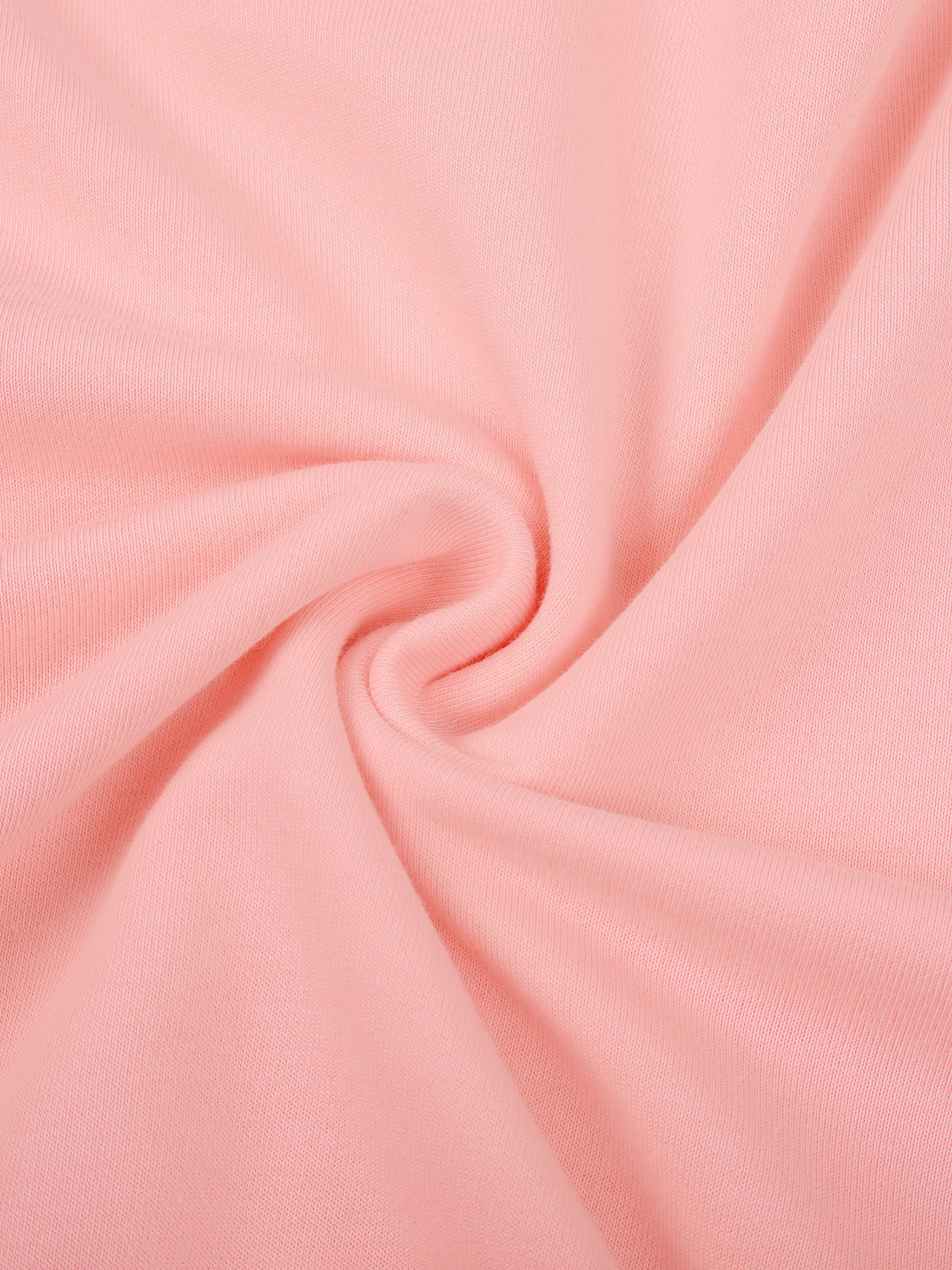 Close-up of soft pink heavyweight sweatshirt fabric with smooth texture and swirl detail