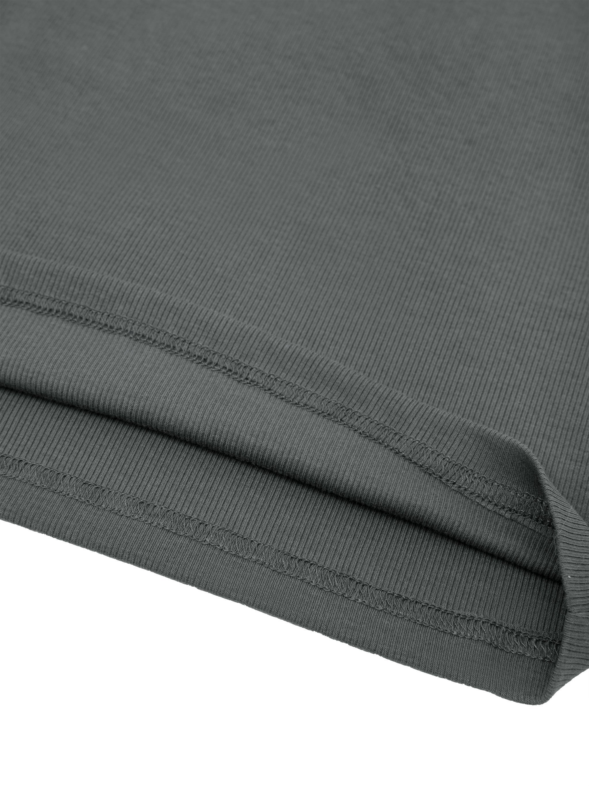 Close-up of ribbed hem on dark gray women’s one-shoulder crop t-shirt