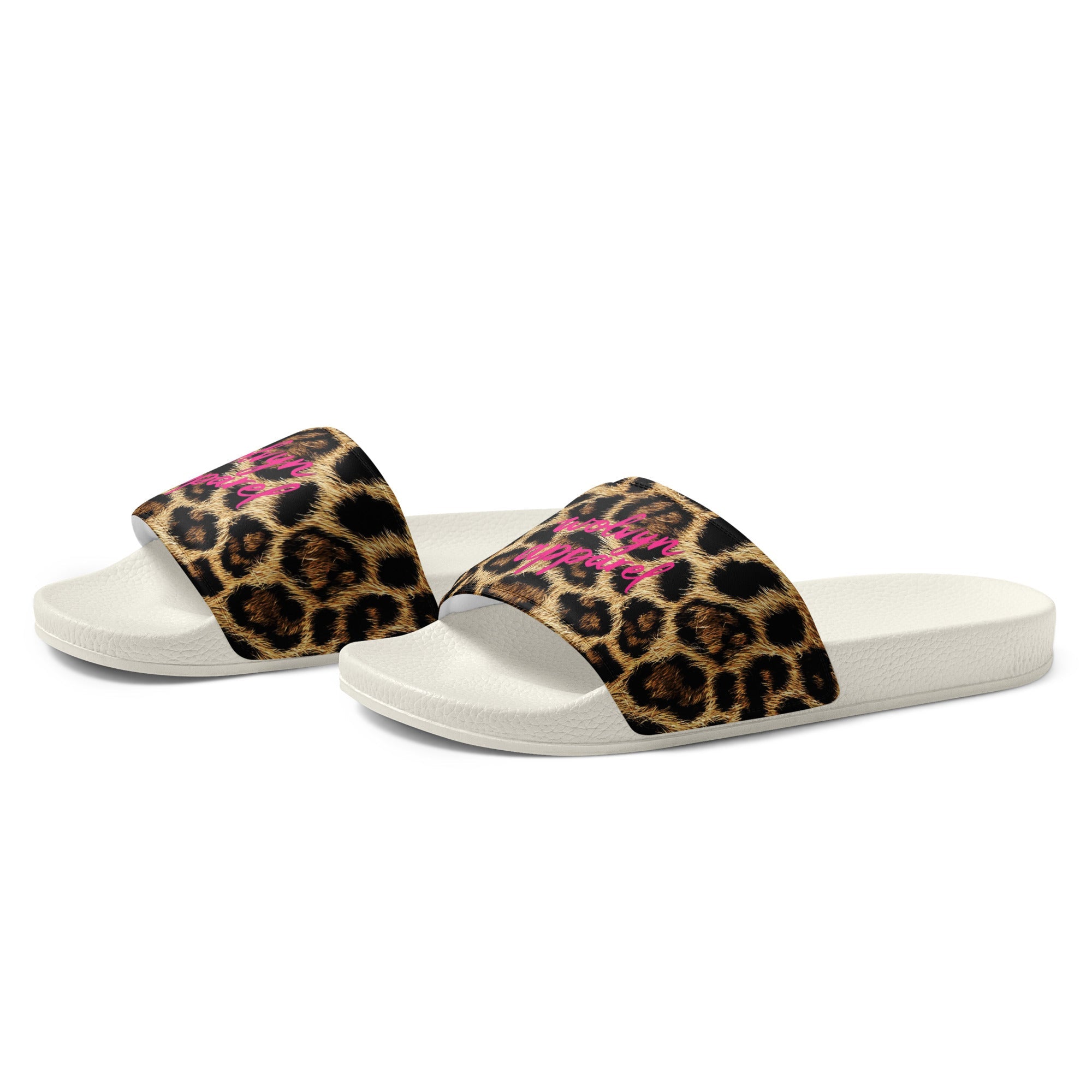 Women's slides with leopard print strap, pink script text, and white sole on white background.