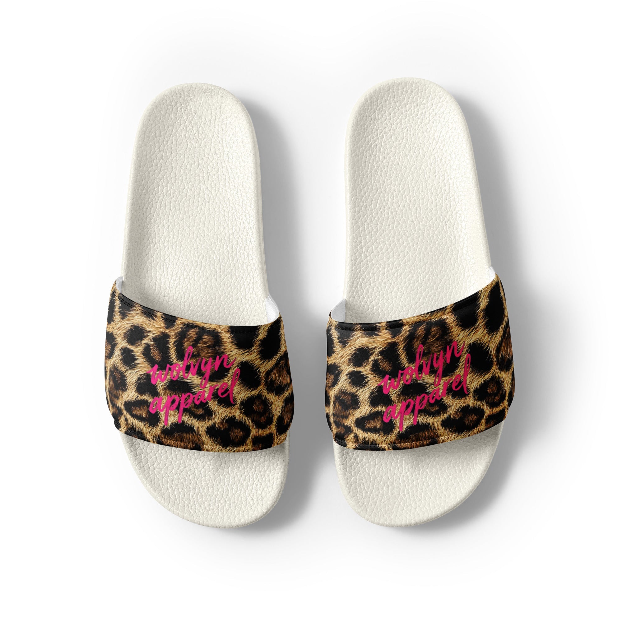 Women's slides with white soles, leopard print straps, and pink script text on top