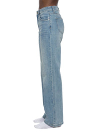 Women's vintage wash flared leg jeans in light blue denim, side profile view.