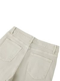 Back view of women's vintage wash flared leg jeans in light beige with two rear pockets