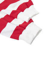 Closeup of red and white color block striped long sleeve cuffs on a heavyweight shirt