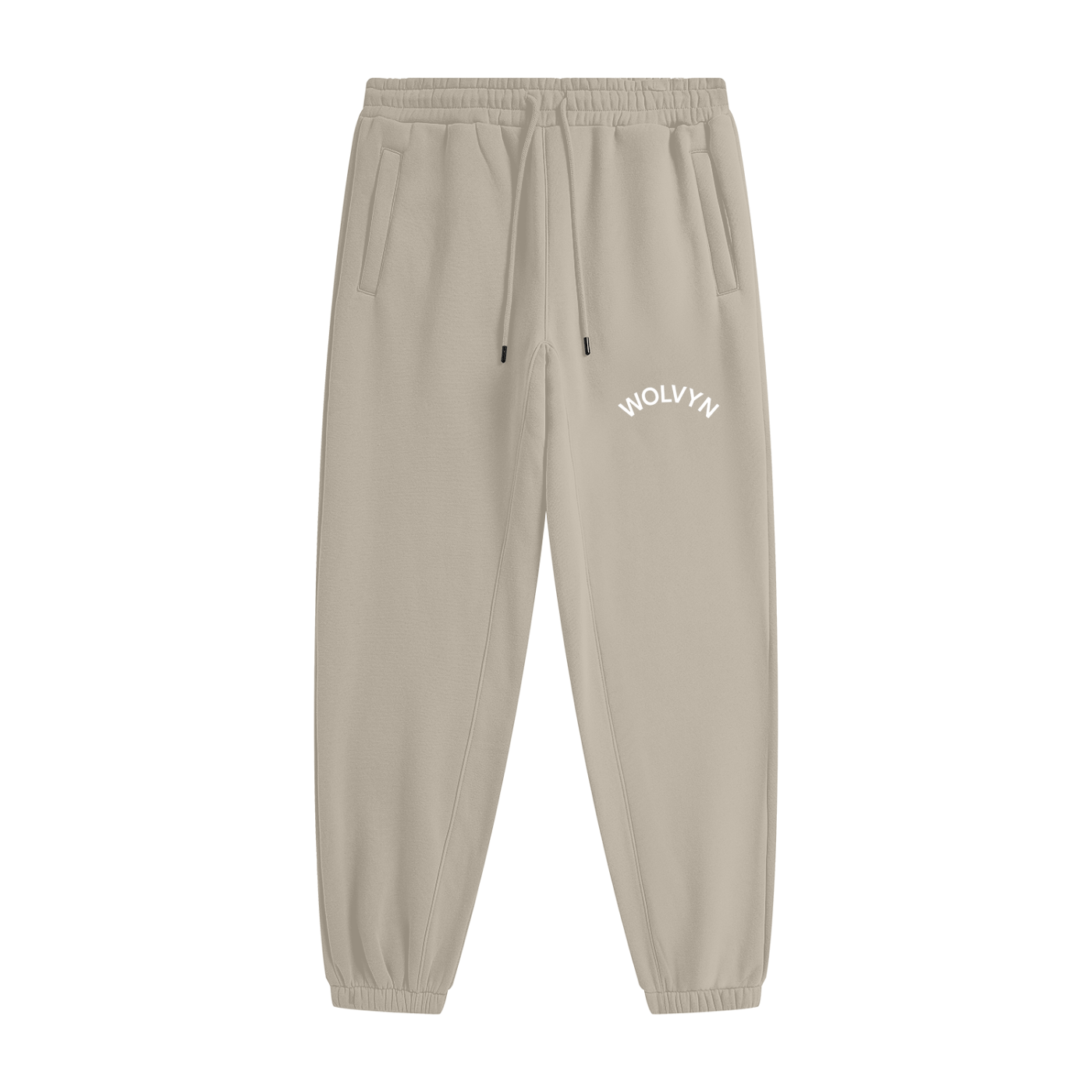 Beige heavyweight fleece joggers with drawstring waist and white WOLVYN logo on left thigh