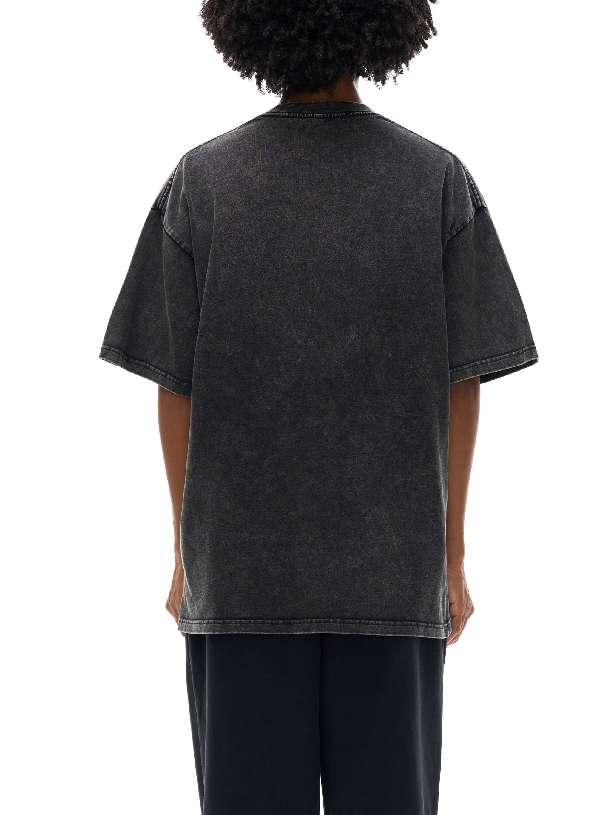 Back view of a black snow-washed oversized cotton t-shirt with short sleeves
