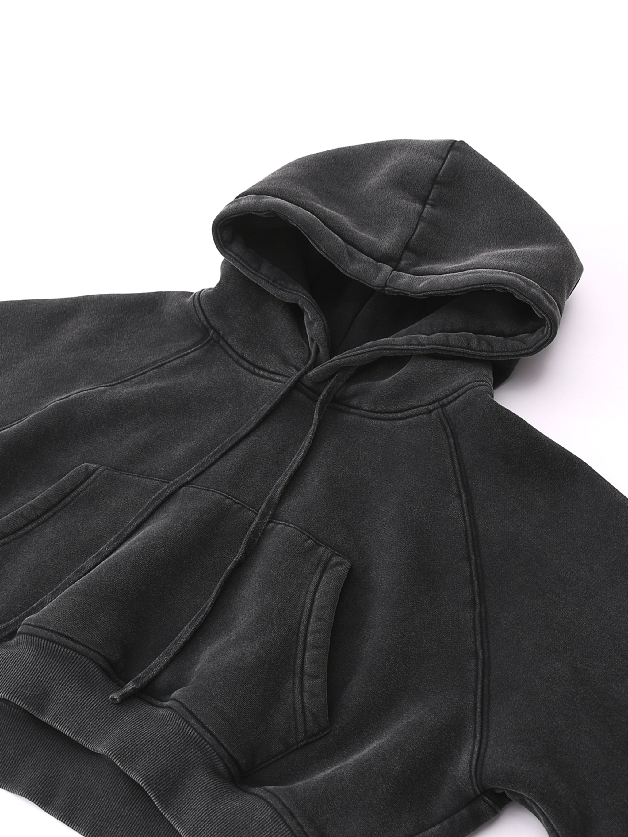 Snow washed black cropped hoodie with kangaroo pocket and drawstring hood on white background