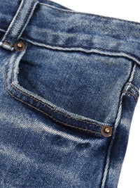 Heavyweight sun-fade denim jeans close-up with front pocket and copper rivets