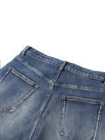 Heavyweight blue denim jeans with sun-faded wash and visible rear pockets
