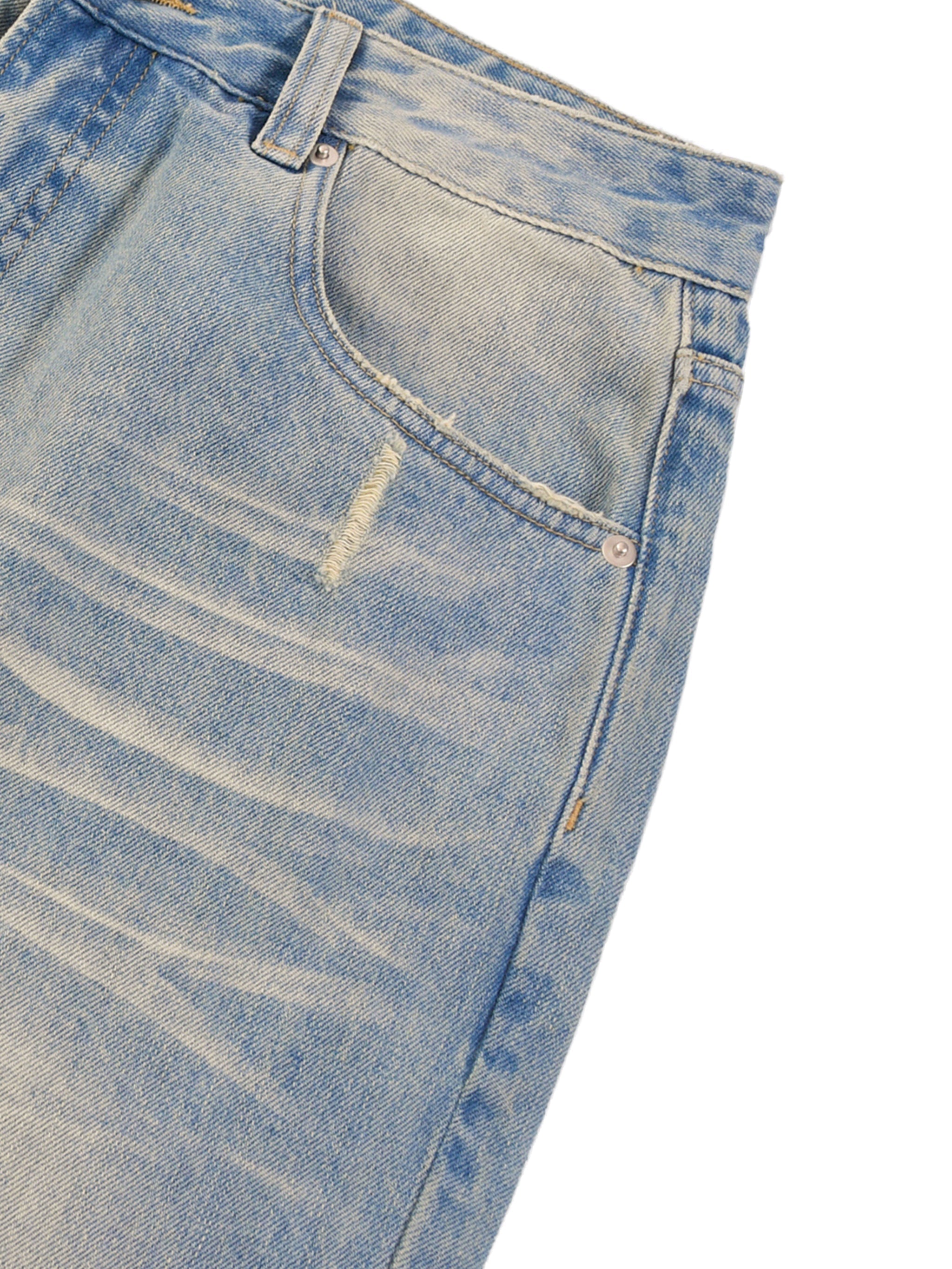 Light blue sun-fade denim jeans with raw hem and distressed detail near pocket