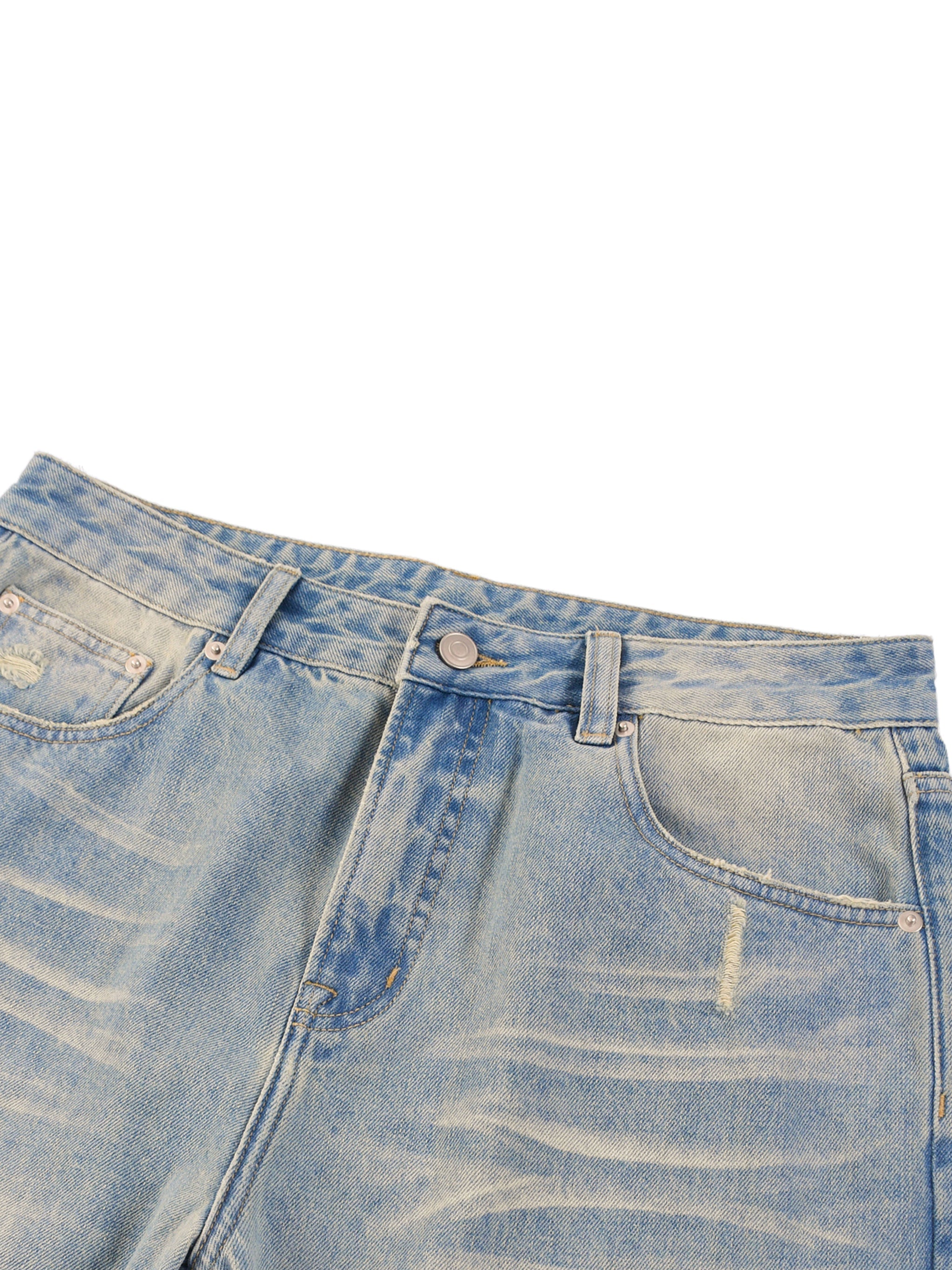 Light wash denim jeans with sun-fade effect, raw hem, and vintage-inspired distressing