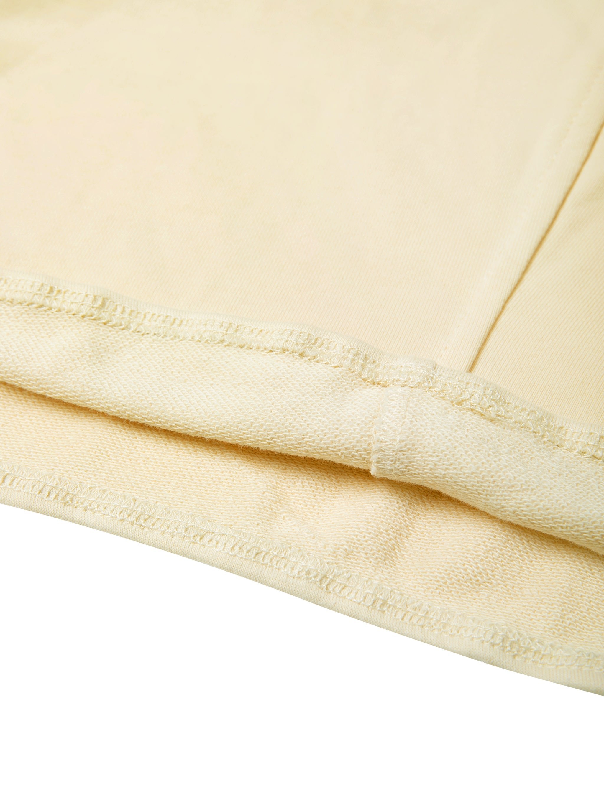 Closeup of beige heavyweight women's cropped tube top fabric and stitching details