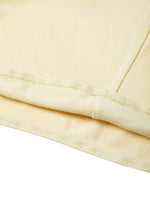 Closeup of beige heavyweight women's cropped tube top fabric and stitching details